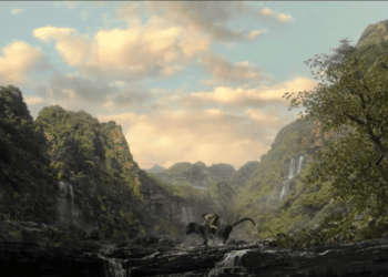 Mowgli riding Bagheera in the Movie 'Mowgli: Legend of the Jungle'
