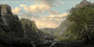 Mowgli riding Bagheera in the Movie 'Mowgli: Legend of the Jungle'