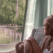 Jade Butterfield (Gabriella Wilde) sitting on a chair looking outside in the 2014 movie 'Endless Love'.