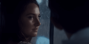 Jennifer Stirling (Shailene Woodley) looking Anthony O'Hare (Callum Turner) in a car in the Netflix movie 'The Last Letter from Your Lover'.
