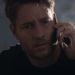 Jake Turner (Justin Hartley) talking to the phone with an astonished expression in the Netflix movie 'The Noel Diary'.