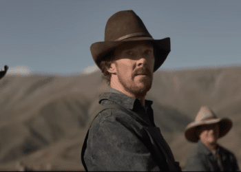 Benedict Cumberbatch in the movie 'The Power of The Dog' sitting on an horse.