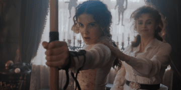 Enola Holmes (Millie Bobby Brown) playing with his Mother (Helena Bonham Carter) in the Netflix movie 'Enola Holmes'.