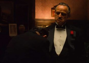 The aging patriarch of an organized crime dynasty transfers control of his clandestine empire to his reluctant son.