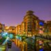 Night view of brick buildings alongside a water channel in the central Birmingham, England