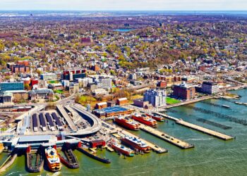 Aerial view of Staten Island St George Ferry terminal. Manhattan Area, New York of USA. Skyline and cityscape with skyscrapers at United States of America, NYC, US. American architecture.