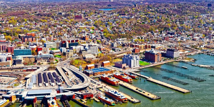 Aerial view of Staten Island St George Ferry terminal. Manhattan Area, New York of USA. Skyline and cityscape with skyscrapers at United States of America, NYC, US. American architecture.