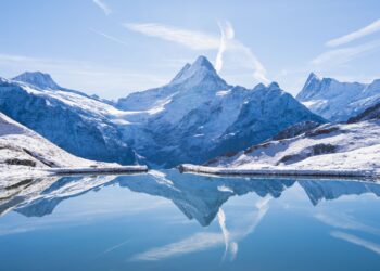 The Alps reflected in the snowy Bachalsee Lake.
