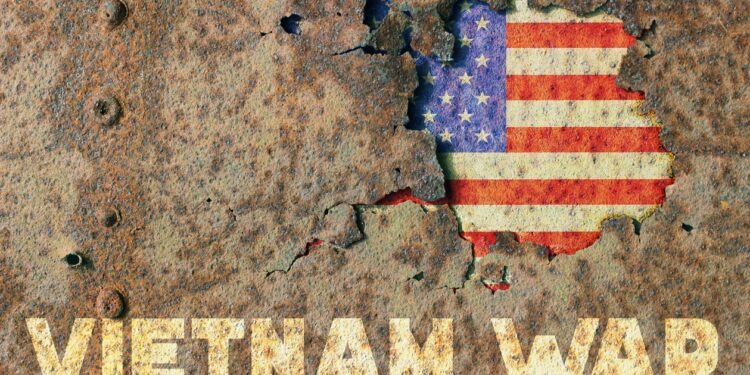 American flag and inscription Vietnam war on rusty armor of a military vehicle