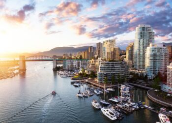 False Creek, Downtown Vancouver, British Columbia, Canada. Beautiful Aerial View of a Modern City on the West Pacific Coast during a colorful Sunset. Sky Composite