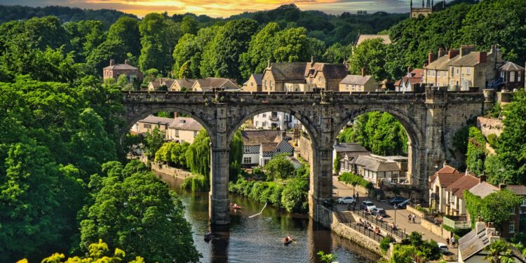 A view of the Viaduct from Knaresborough Castle, North Yorkshire, UK. Summer greenery at sunset.