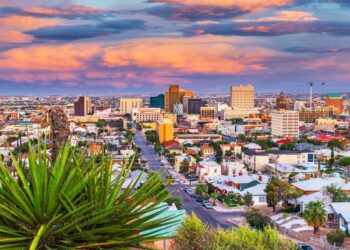 El Paso, Texas, USA downtown city skyline at dusk with Juarez, Mexico in the distance.