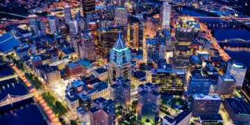 An aerial shot of the night Pittsburgh cityscape in Pennsylvania