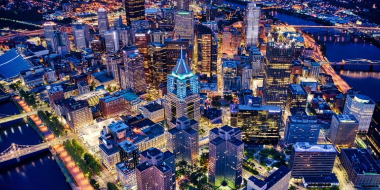 An aerial shot of the night Pittsburgh cityscape in Pennsylvania