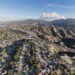 Aerial cityscape view of suburban sprawl in the Santa Clarita community of Los Angeles County, California.