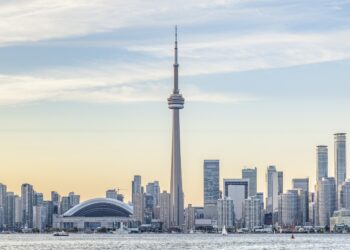 View of Downtown Toronto skyline with the CN Tower and the Financial District skyscrapers at sunset.