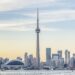 View of Downtown Toronto skyline with the CN Tower and the Financial District skyscrapers at sunset.